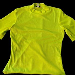 Neon-yellow mock neck. Buttons under pelvis.